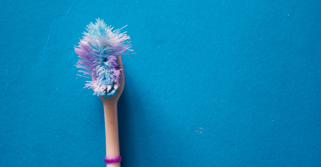 An old toothbrush with bristles splaying outwards.