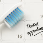 Reminder "Dentist appointment" in calendar with toothbrush.