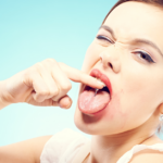 Funny woman with pierced tongue.