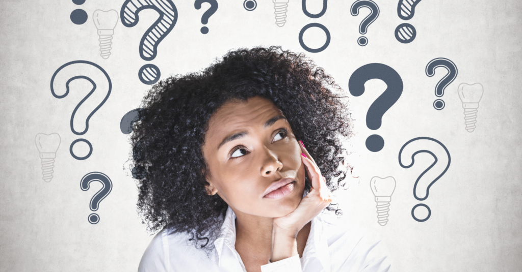 woman holding her head in her hand and looking up, illustrations of dental implants and question marks are above her