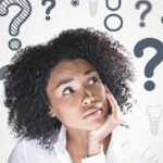 Woman holding her head in her hand and looking up, illustrations of dental implants and question marks are above her.