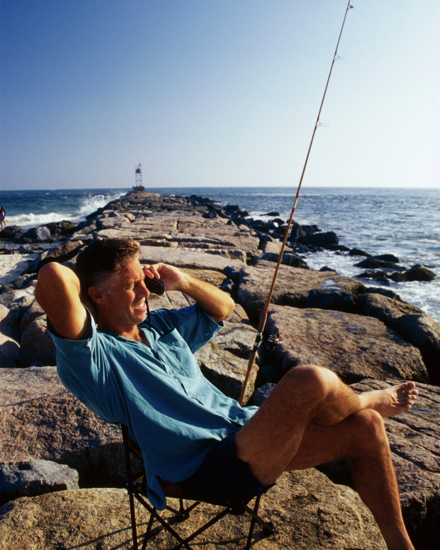 Man fishing on beach.